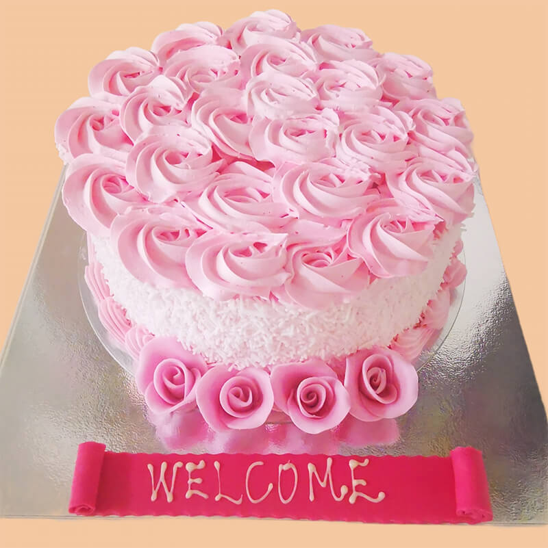 Round Wedding Cake With Pink Cream Roses And Pink Icing Edible Roses ...